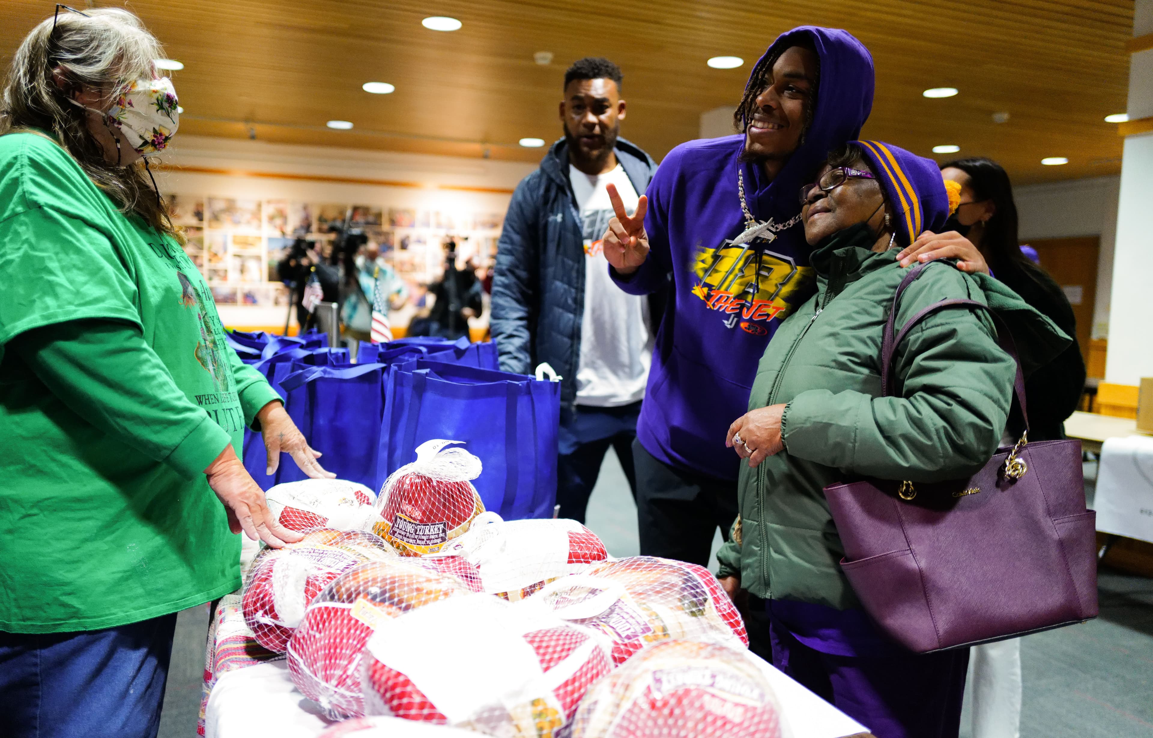 Handing out turkeys at the community Turkey Drive