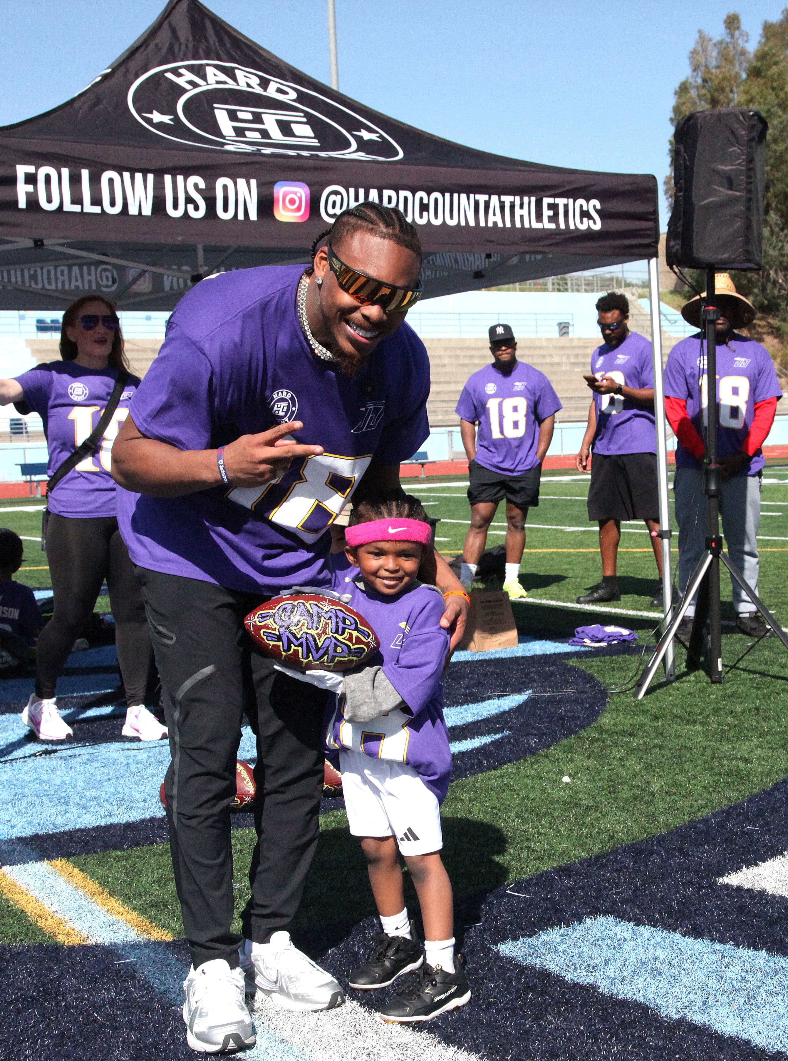 Justin with a young camper at the HardCount tent